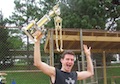 The Bones Brigade skeleton mascot latches onto their trophy